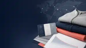 Apparel sourcing benchmark visual showing garments, a global supplier map and a declining cost curve.